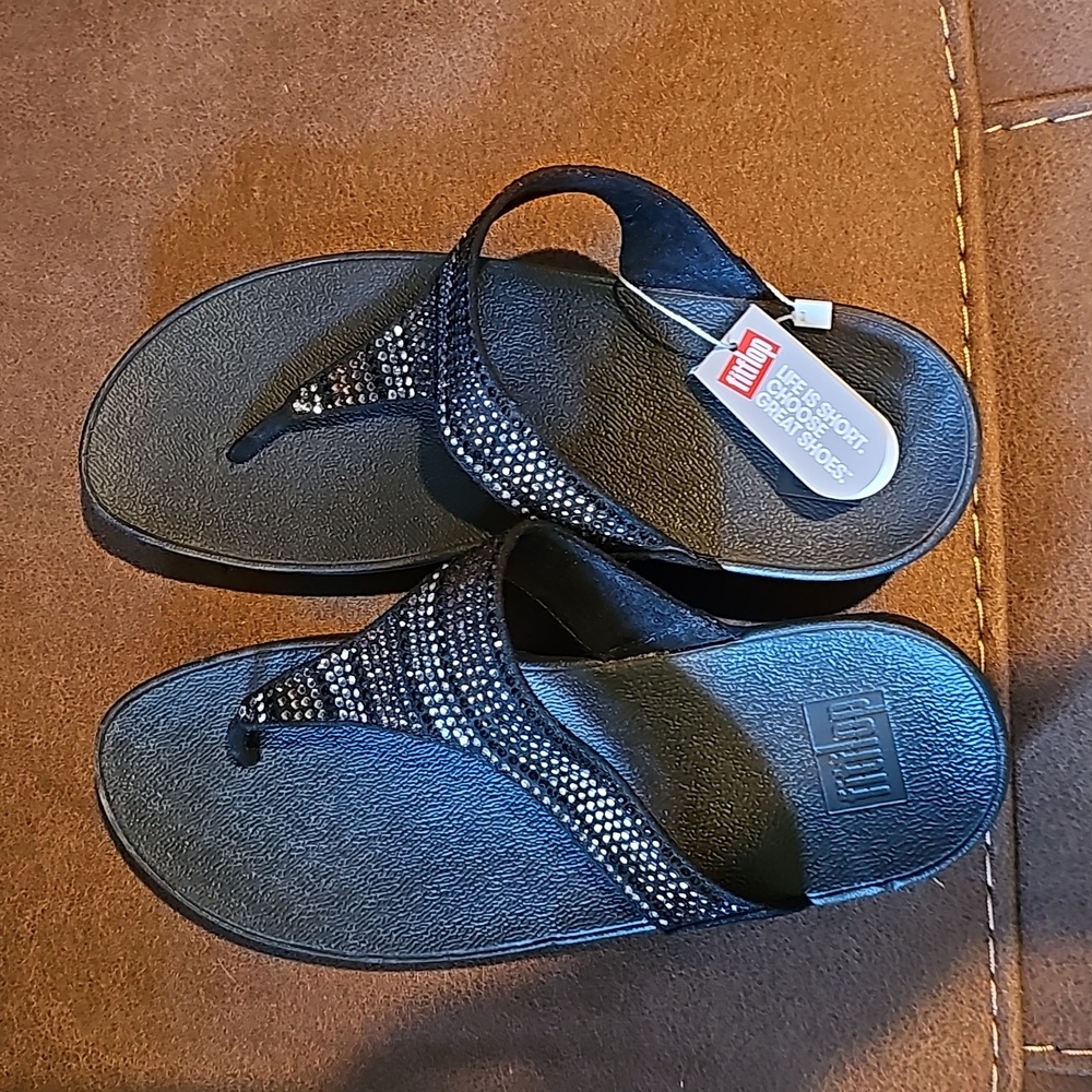 Black bejeweled flip flops